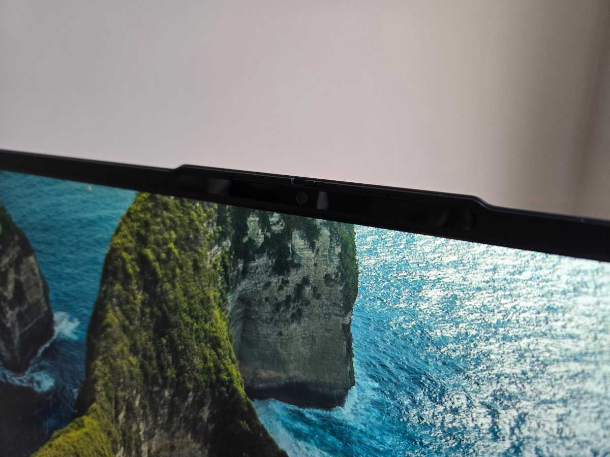 Close-up of the laptop's top bezel showing the 1080p webcam and its manual privacy shutter.
