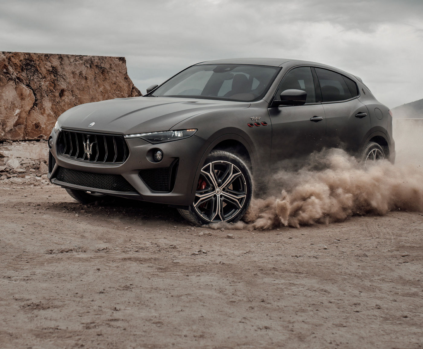 A white Maserati Levante luxury SUV parked in a scenic location.
