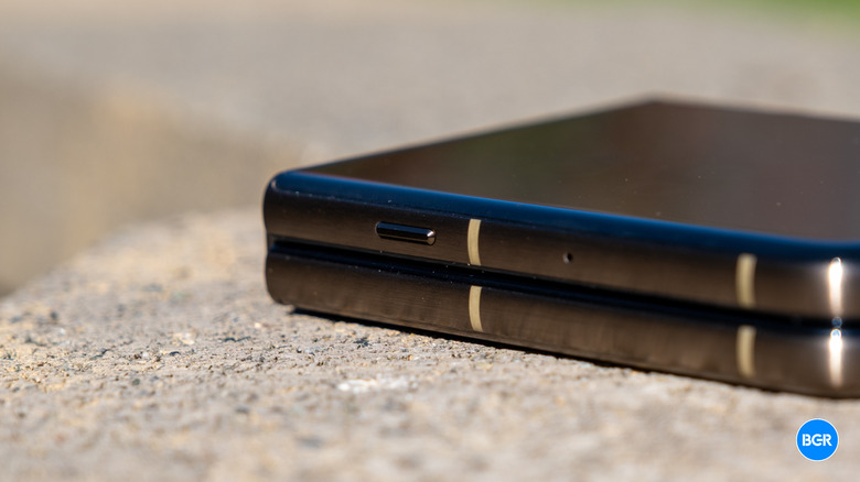 Close-up of the dedicated AI hardware button on the side of the Motorola Razr Ultra.
