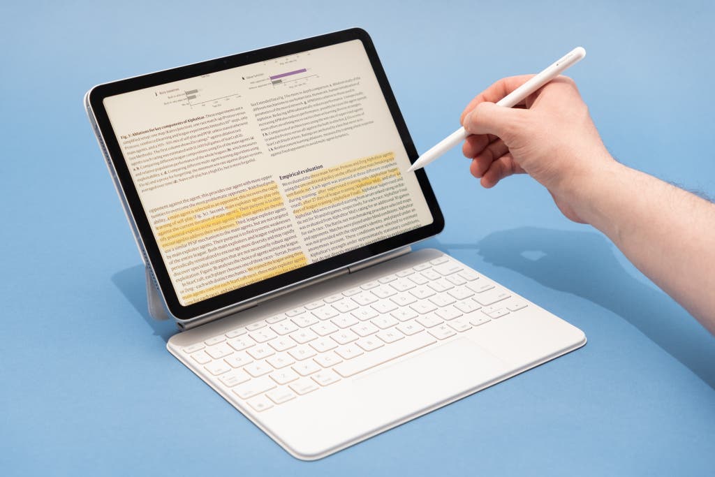 A person using an Apple Pencil Pro to highlight text on an 11-inch iPad Air M3.