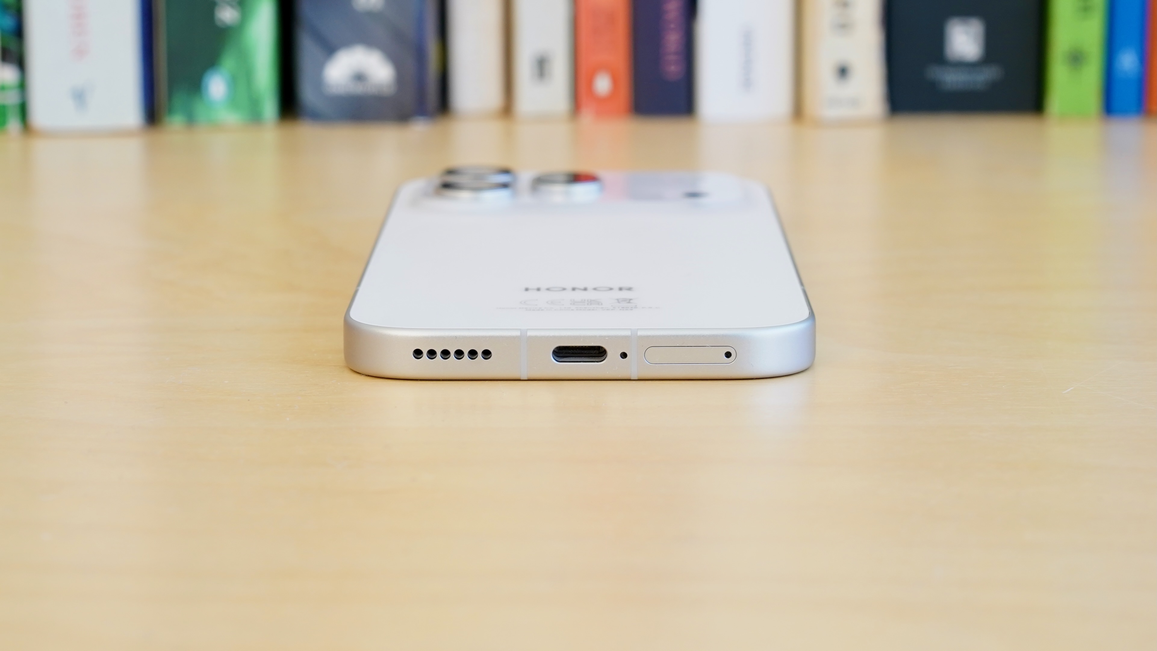 Back of the white Honor 600 Pro featuring a unique marble-like textured finish.