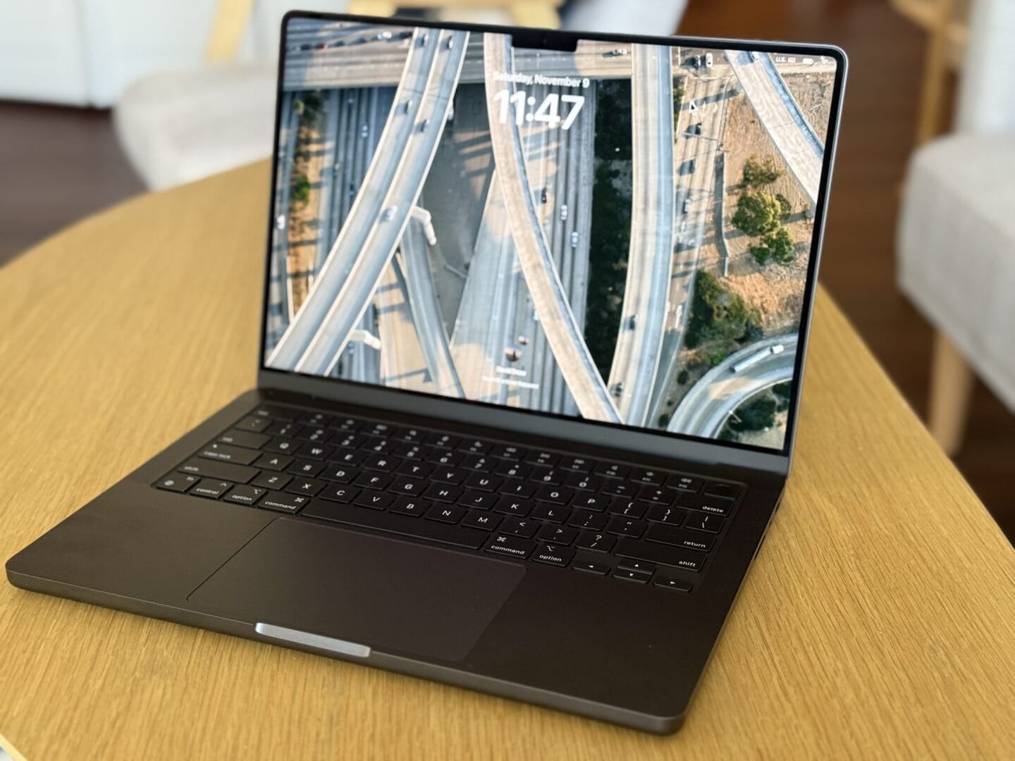Side profile of a silver MacBook Pro highlighting the HDMI, MagSafe, and SD card ports.