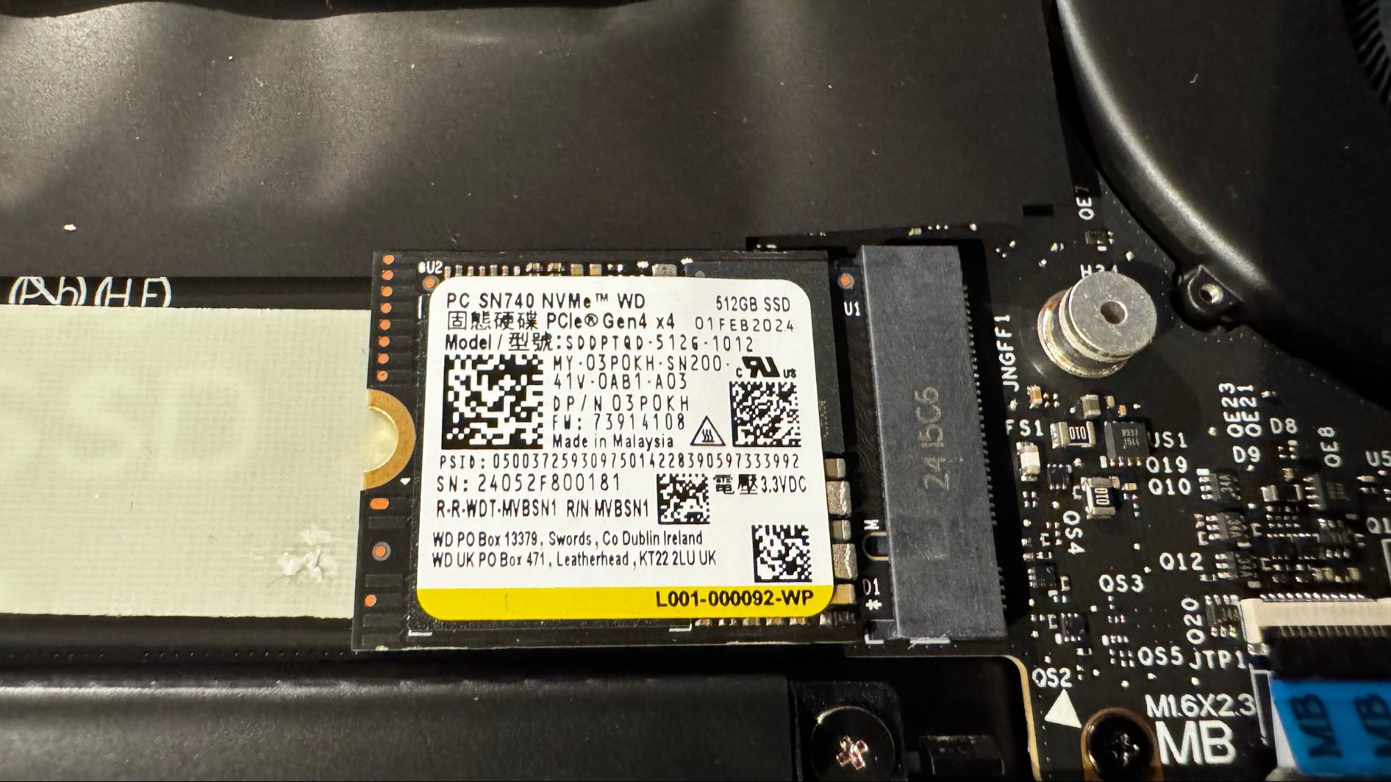 Internal view of the Dell XPS 13 showing the dual cooling fans and thermal pipes.