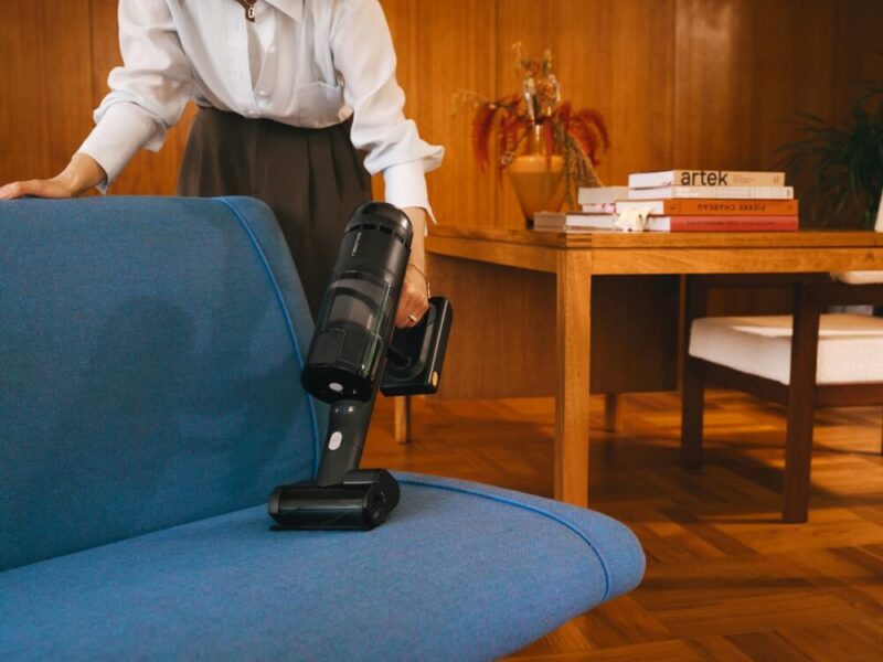 Close-up of the Roborock H60 Hub Ultra handle showing the digital display and trigger.