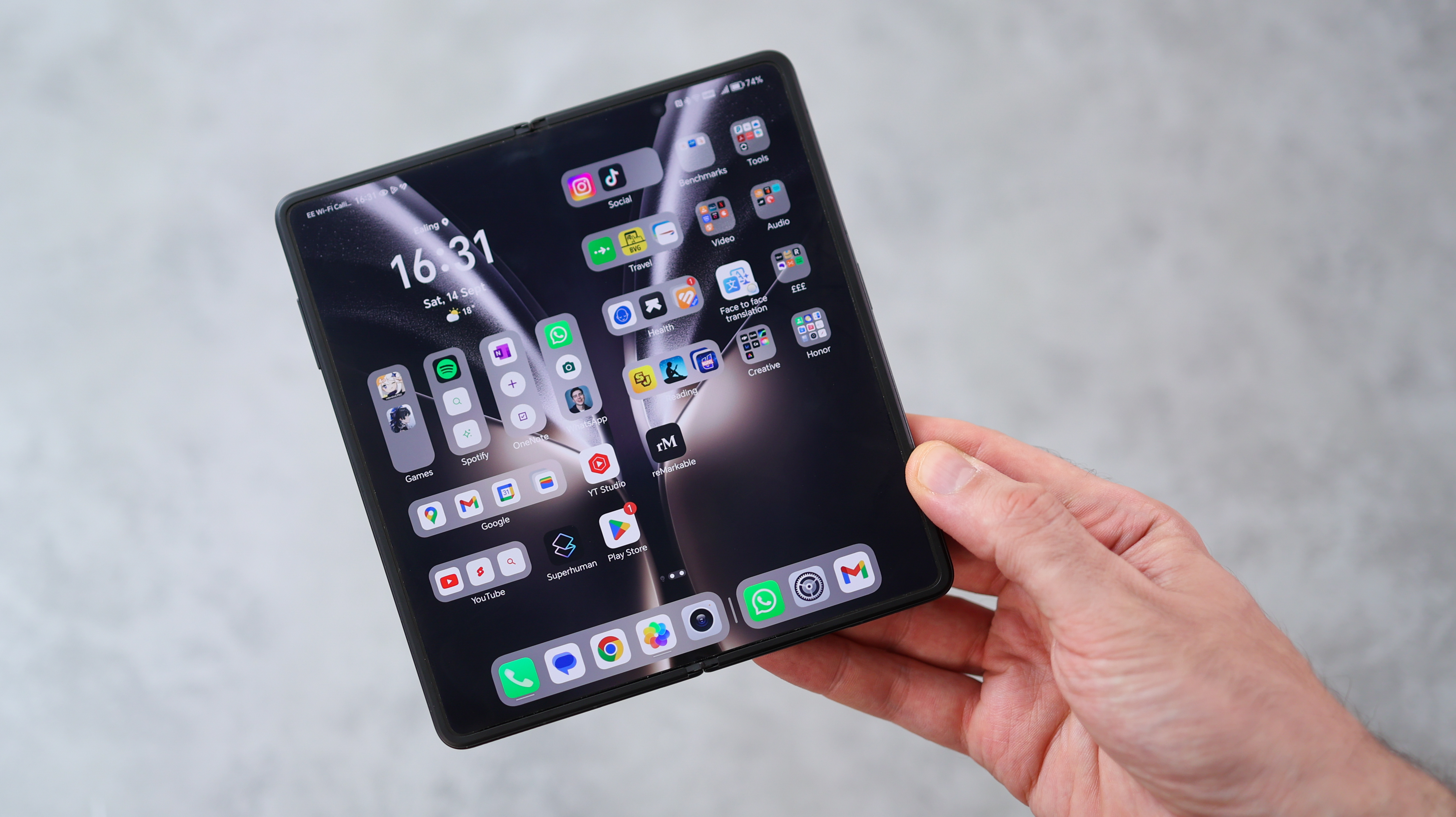 The Honor Magic V3 in a reddish brown finish.