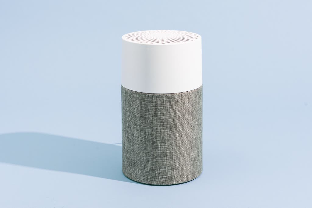 A small, cylindrical budget air purifier designed for desktop or small bedroom use.