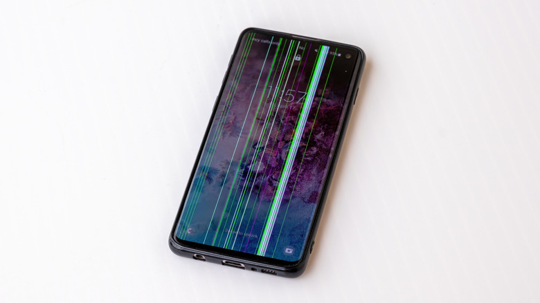 A Samsung Galaxy S10 phone showing vertical green lines across the display panel.