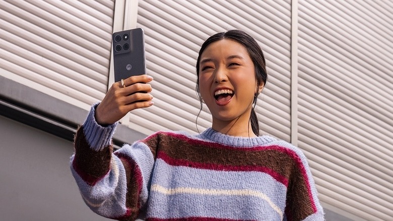 A person using the stylus to interact with the Motorola Moto G Stylus 2026 smartphone.