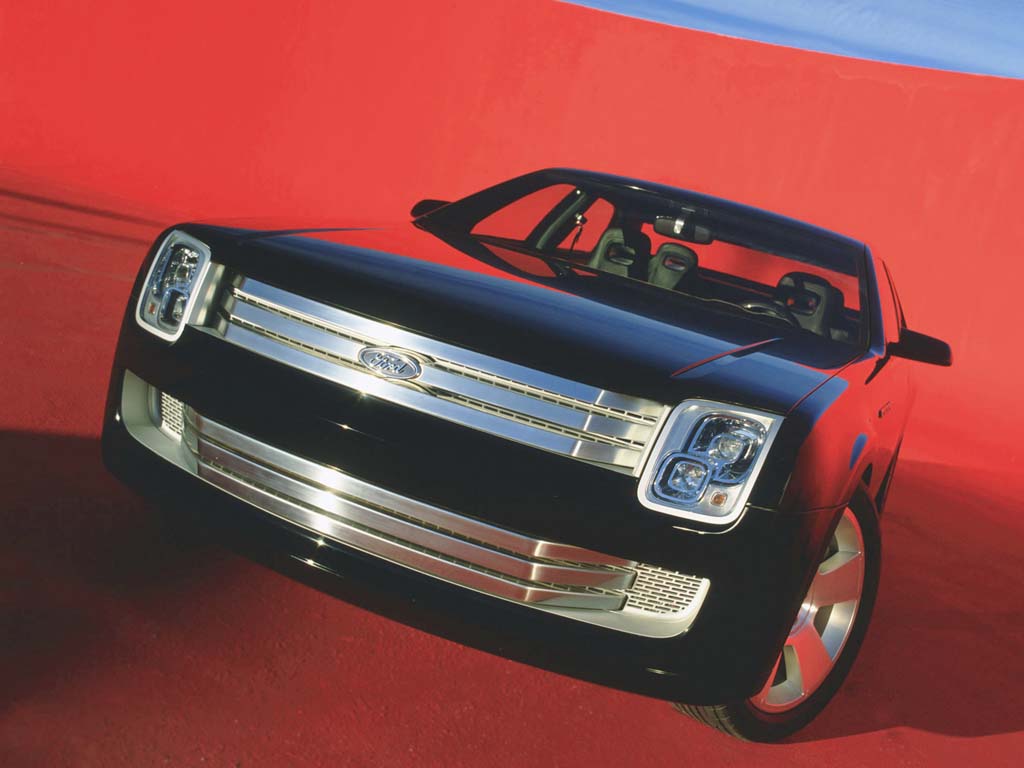 Close-up of the Ford 427 Concept's analog instrument cluster with red illumination.