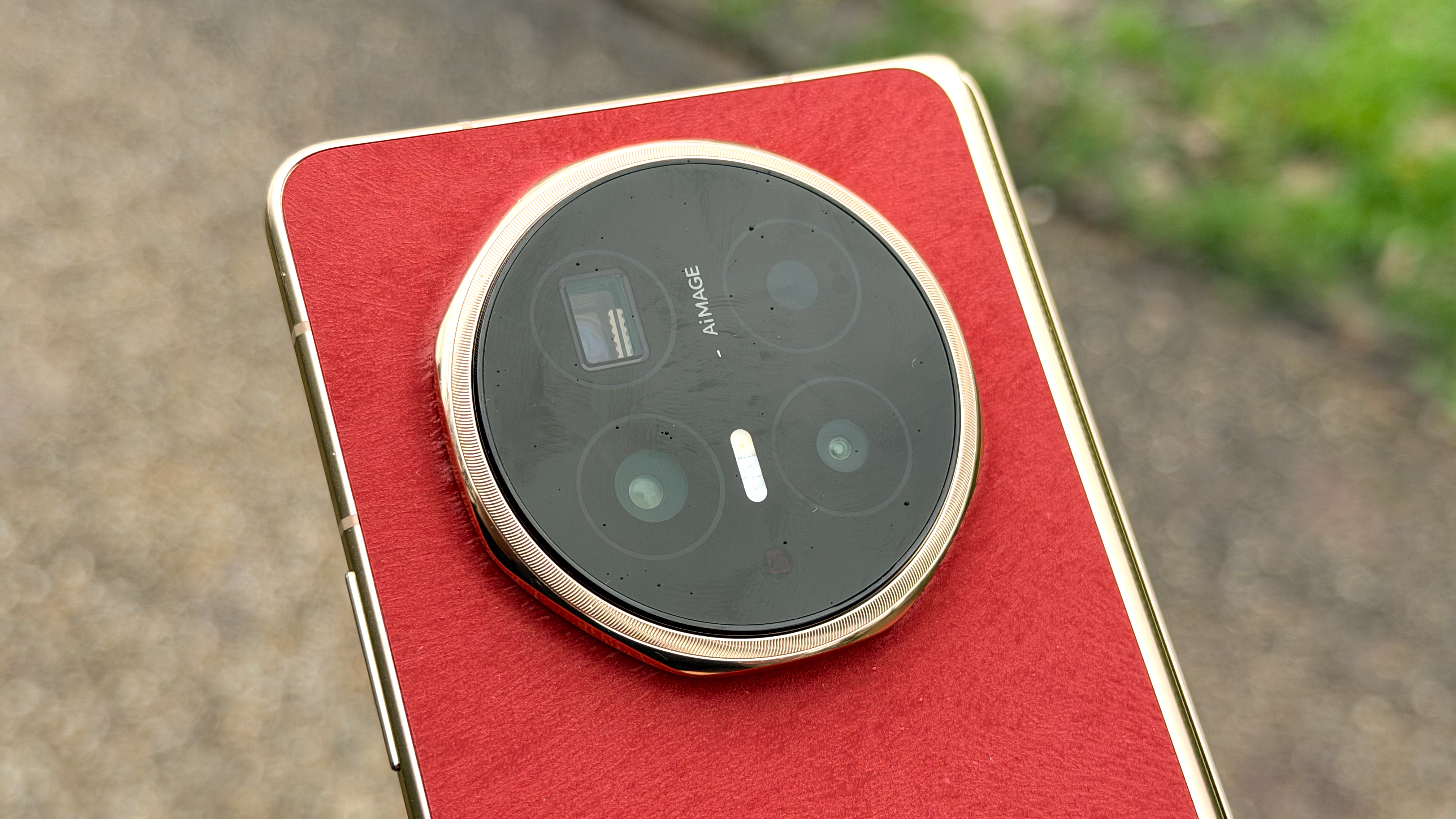 Close-up of the circular rear camera module on the Honor Magic V6 featuring three lenses.