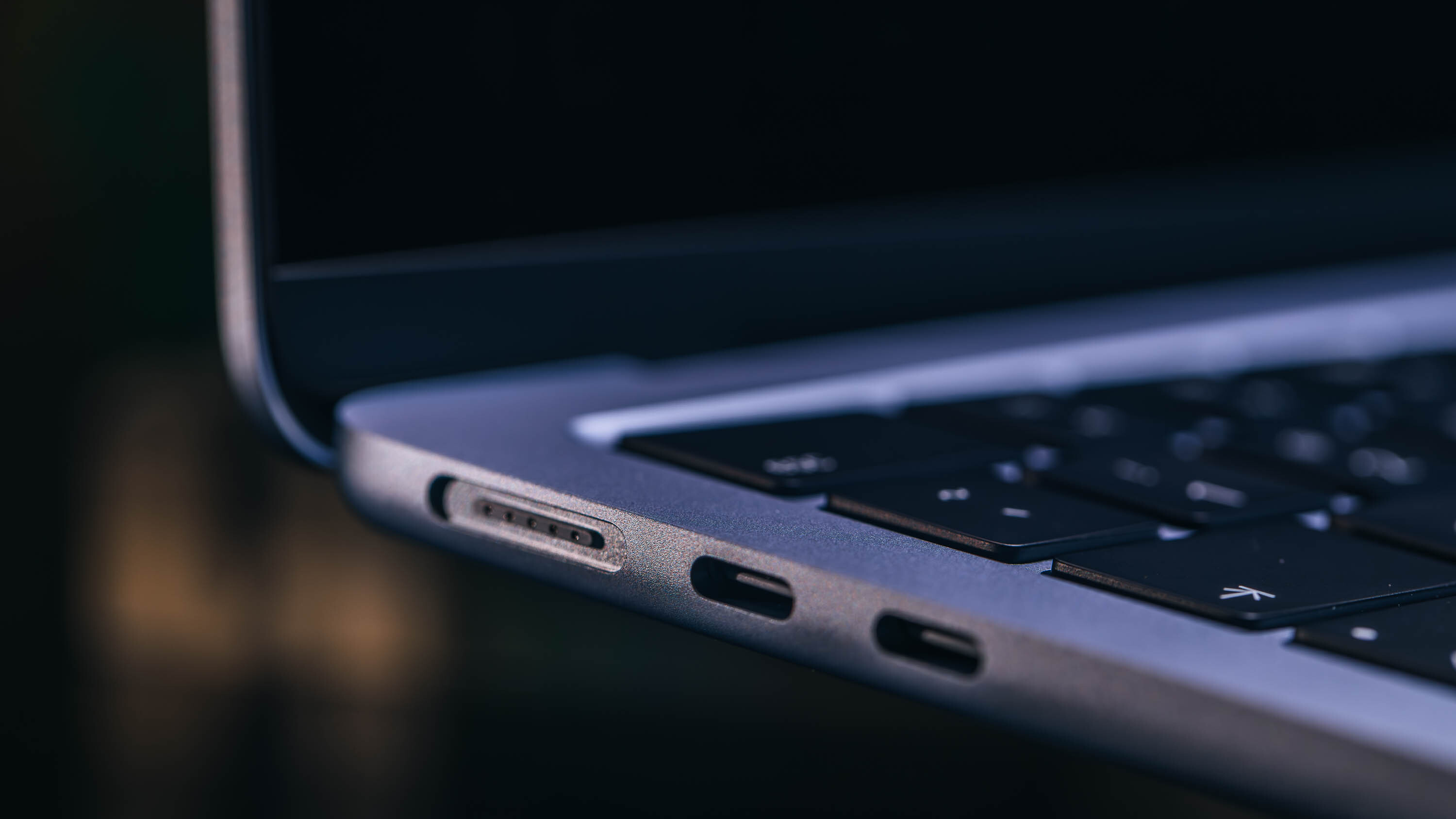 Side profile of the MacBook Air showing two Thunderbolt ports and the MagSafe 3 charging port.