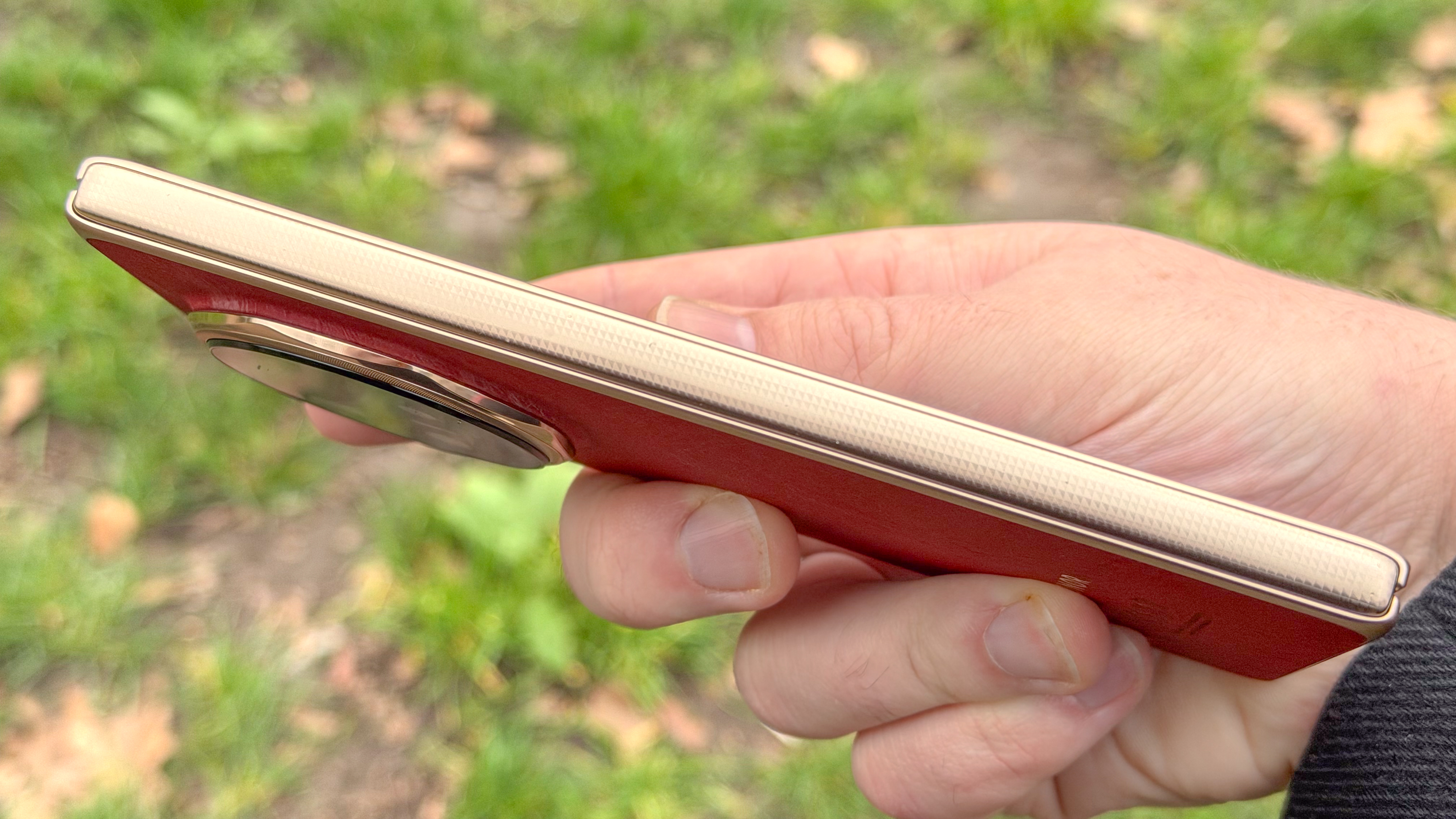 A macro shot focusing on the intricate hinge design and the seamless fold of the Honor Magic V6.