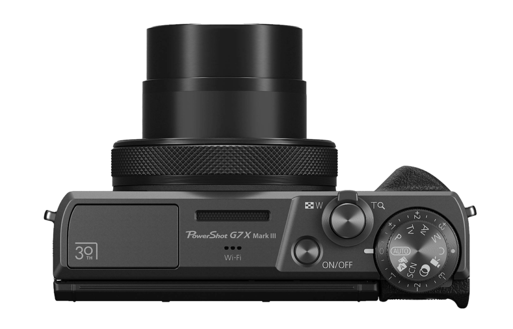 A side profile view showing the diamond-knurled grip ring and metallic finish of the anniversary camera.