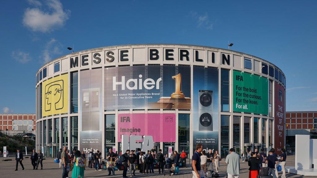 Wide shot of the Messe Berlin entrance under a clear blue sky during IFA 2025.