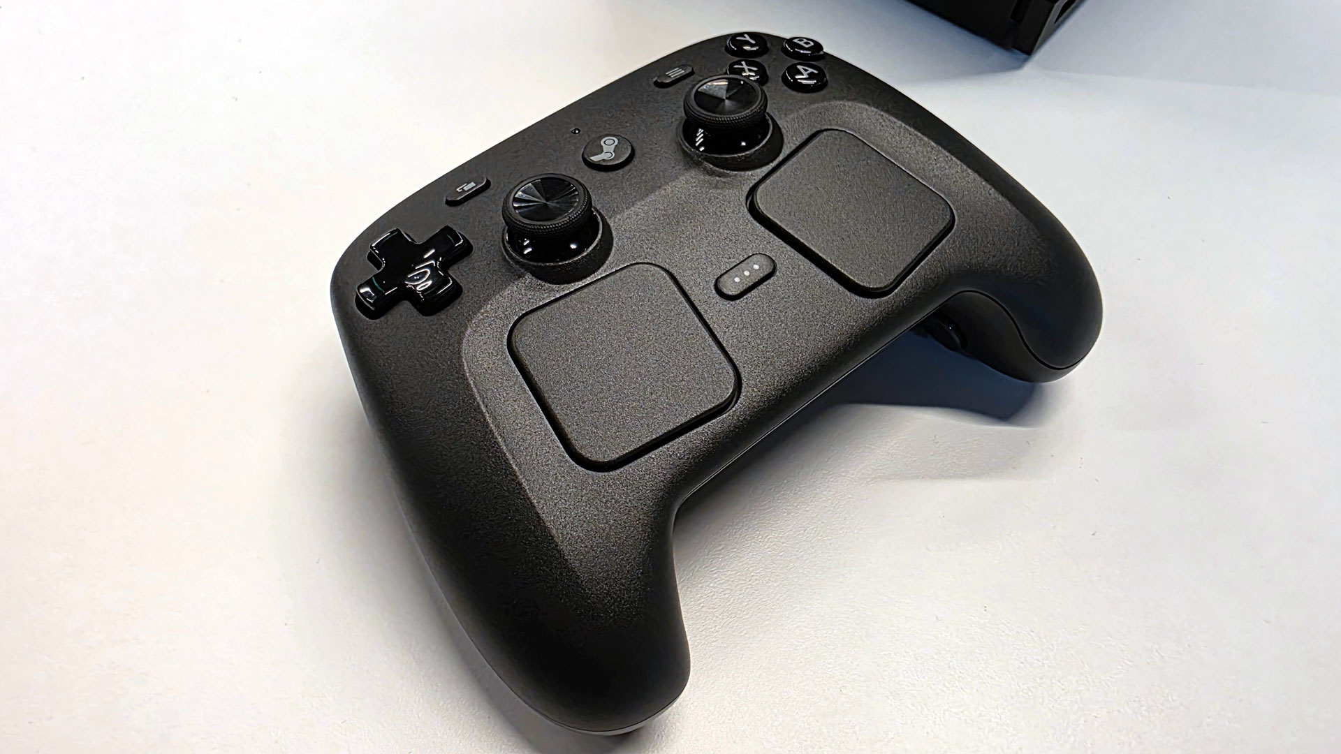 The new Steam Controller with its unique trackpad and joystick layout.