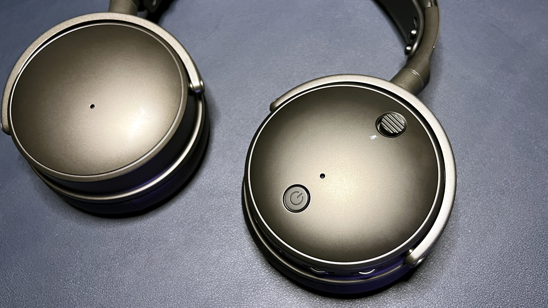 Close-up detail of a premium headset's metal frame and tension headband.