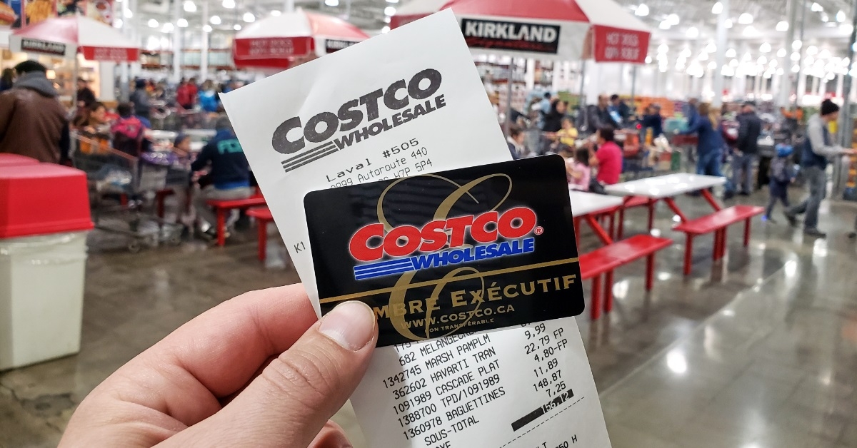 A Costco Executive Membership card resting on a shopping receipt.