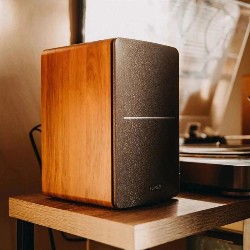 Edifier R1280DB active bookshelf speakers with a wood grain finish.