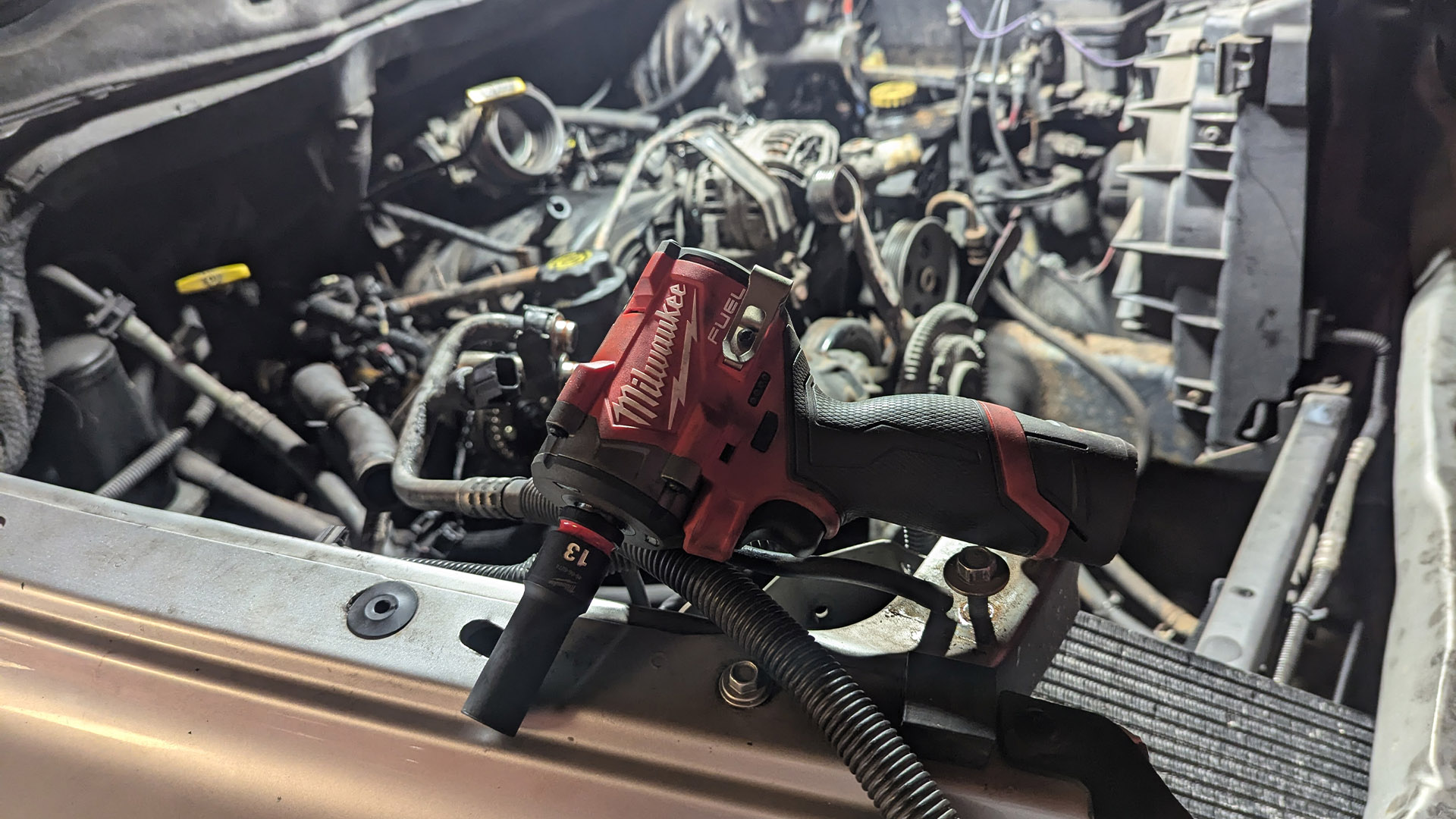 Close-up of the Milwaukee Gen II M12 Stubby impact wrench with a socket attached.
