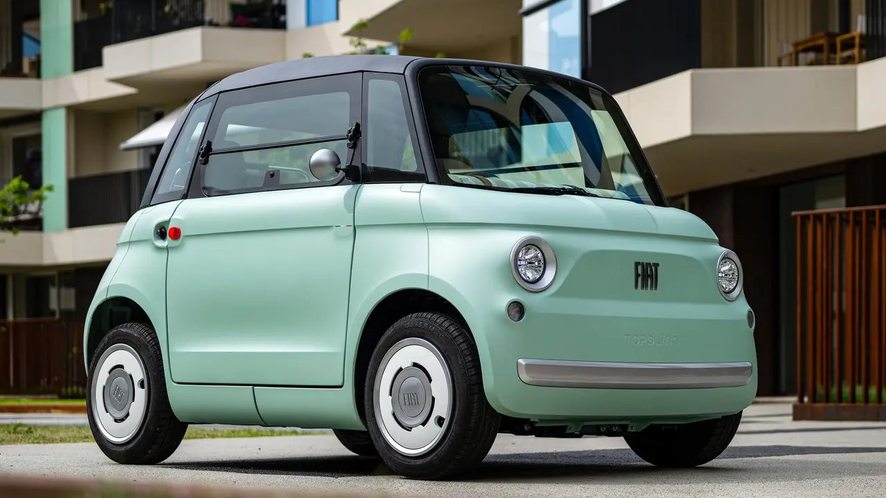 The Fiat Topolino parked on a narrow European-style urban street