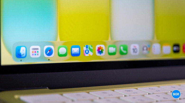 MacBook Neo screen showing the macOS desktop and various application icons.