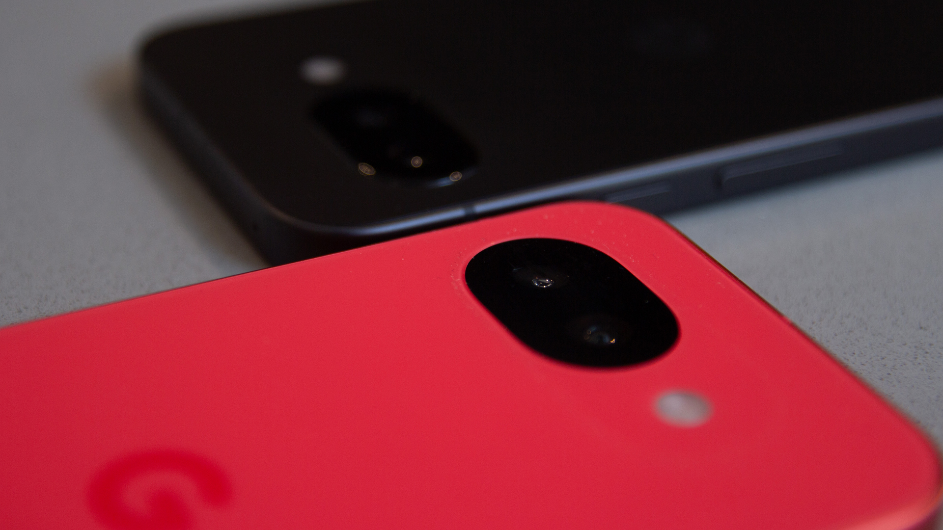 Macro close-up of the Pixel 10a dual camera sensors.