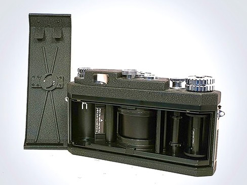 Internal view of a Widelux camera showing the central rotating lens barrel.