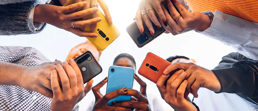 A modern high-end smartphone with a bezel-less screen showcasing high-definition graphics.