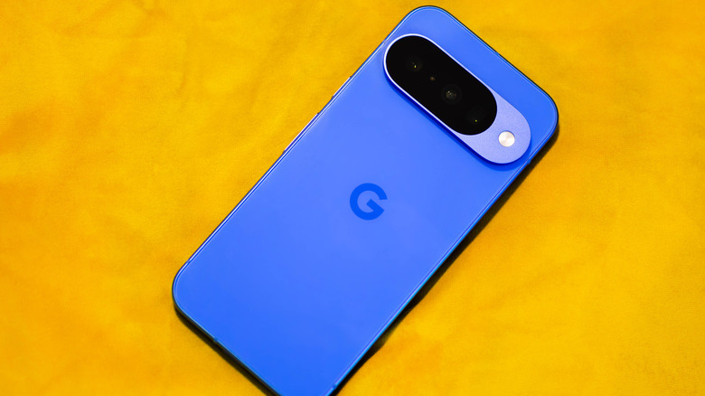 Google Pixel 10 smartphone in a deep Indigo color.