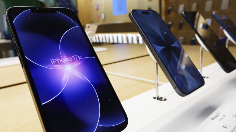 Newer iPhone 17 models displayed to showcase the generational evolution.