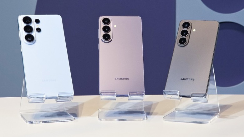 A group of Samsung Galaxy S26 series smartphones on a display stand.