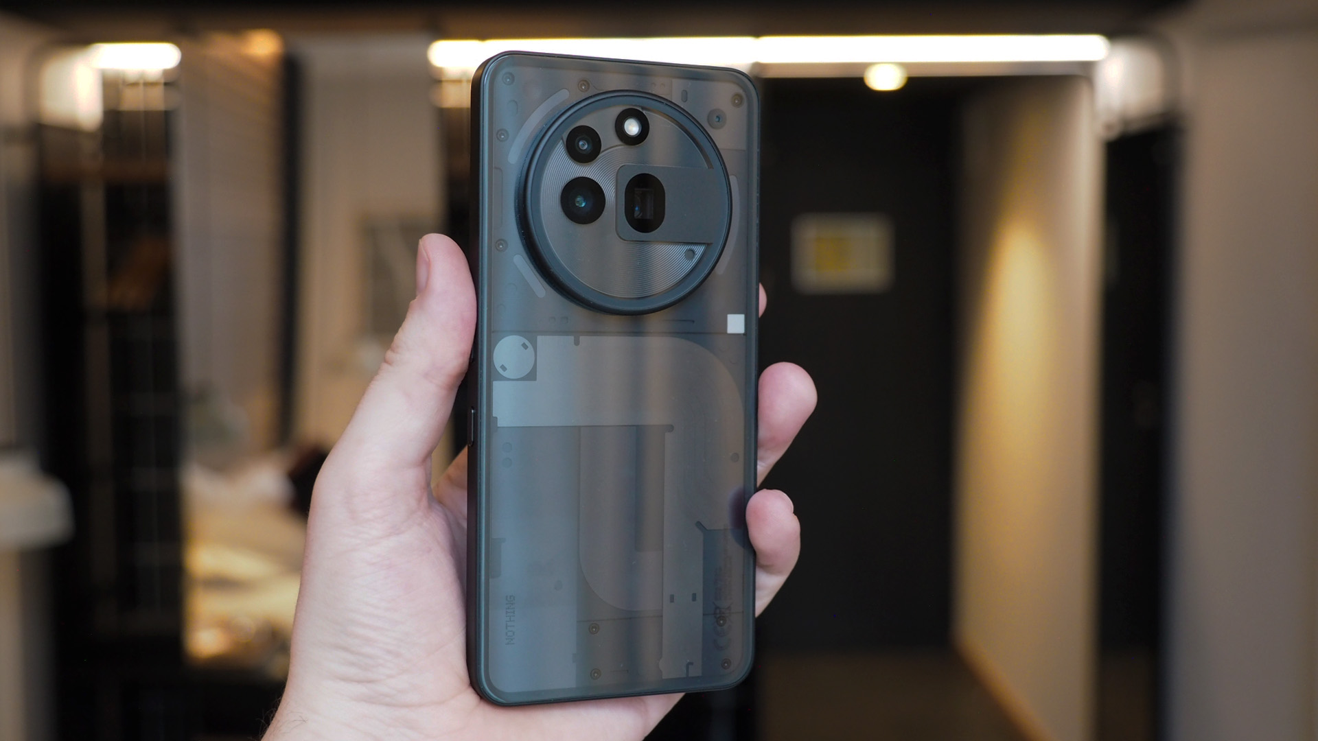 The Nothing Phone (3a) Pro showing its transparent back and internal components.