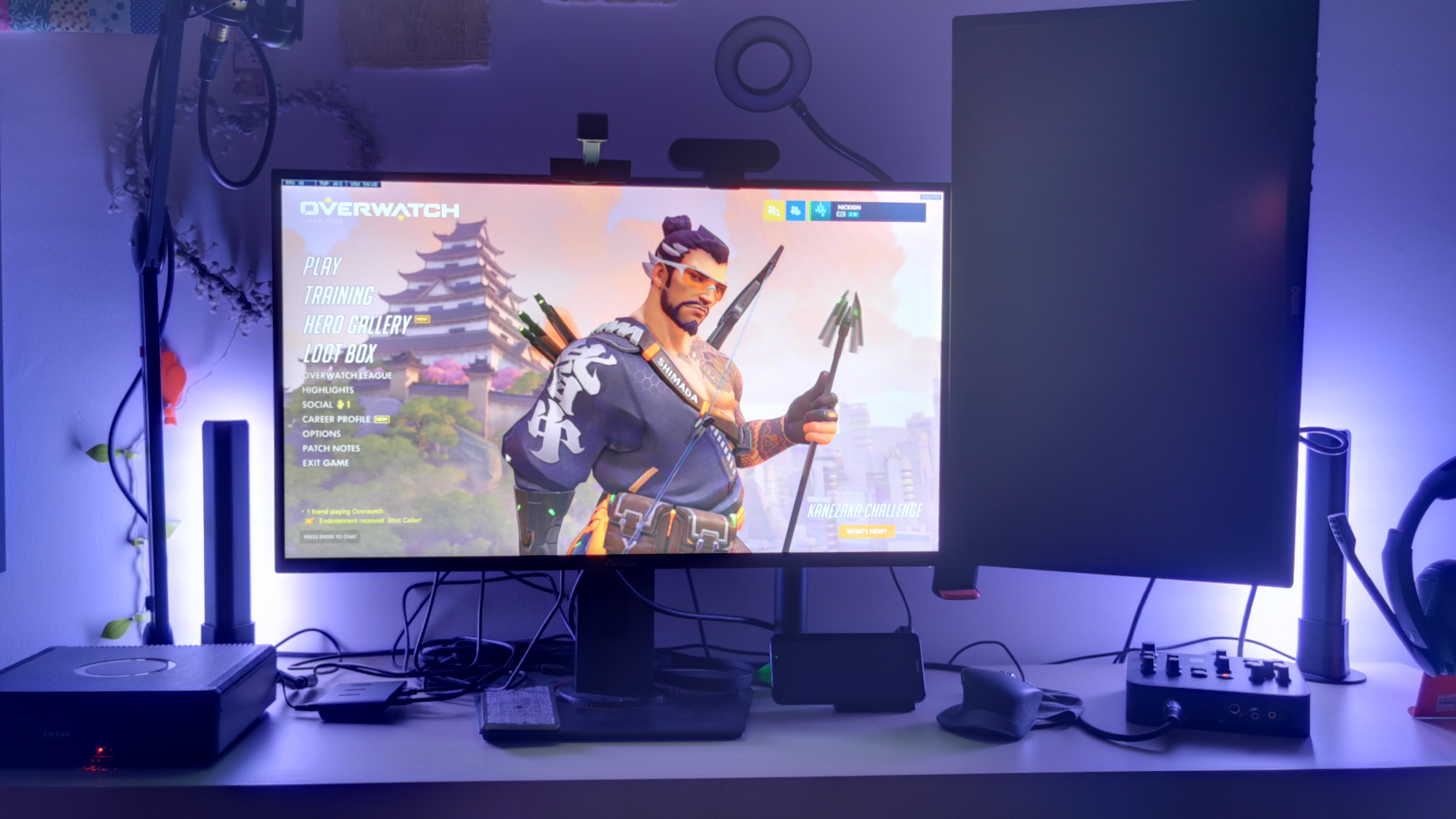 Home theater setup featuring Govee smart light bars casting colorful ambient light on the wall behind a TV.