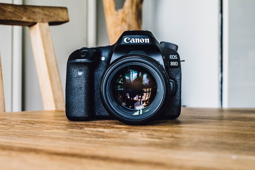 A modern digital image sensor module being precisely aligned within the film gate of an analog camera.