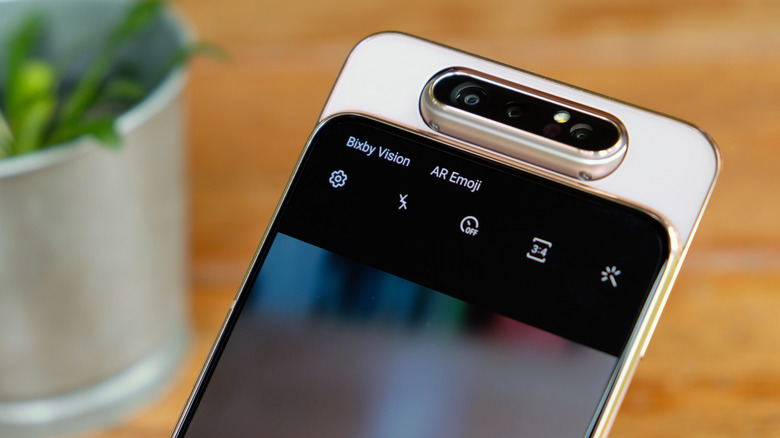The back of a Samsung Galaxy A80 with its unique sliding and rotating camera module extended.