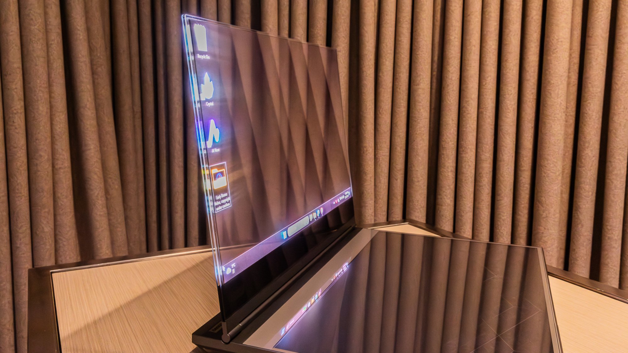 Side profile of the Lenovo transparent laptop showing the thinness of the Micro-LED panel.