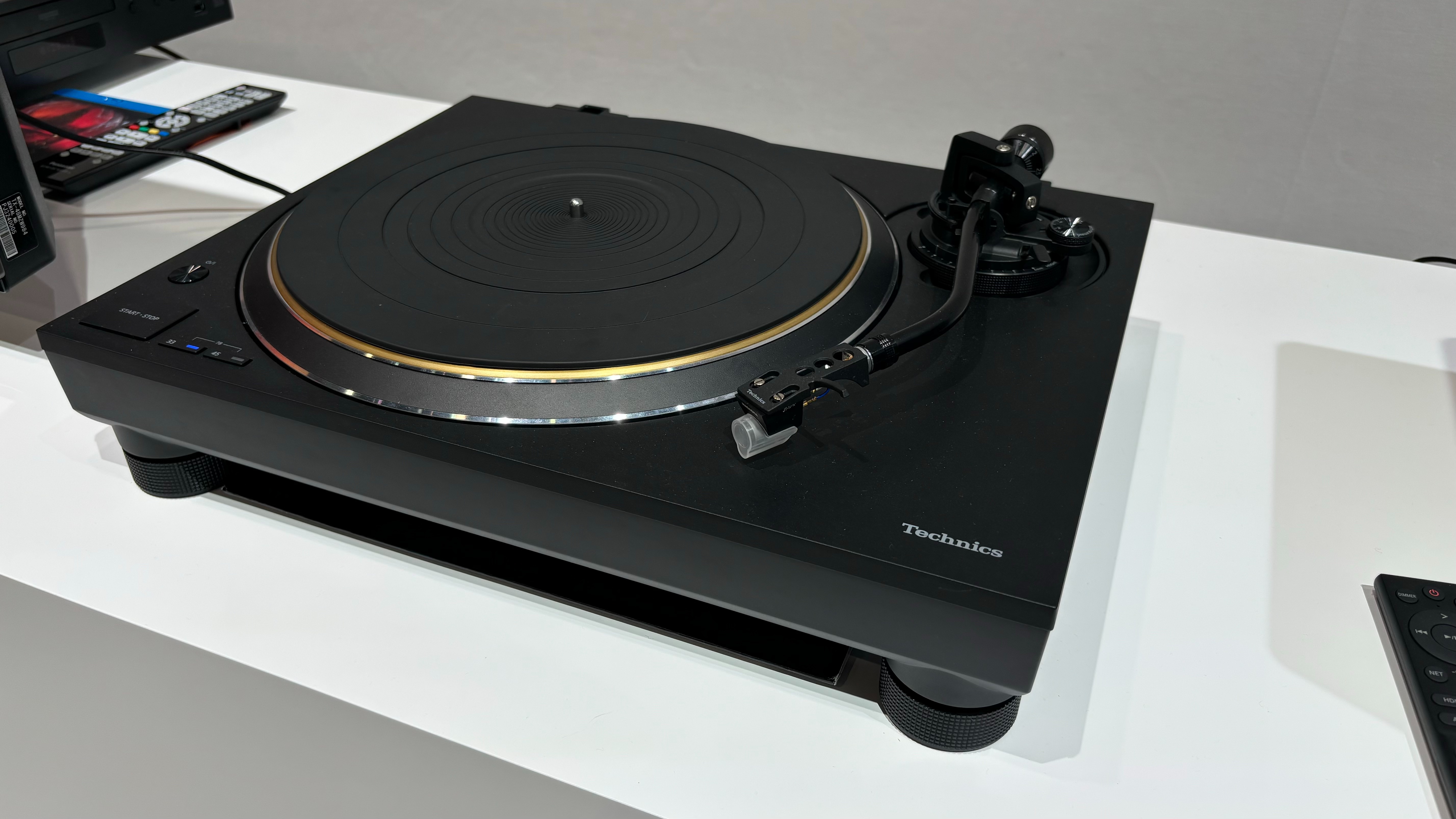 The Technics SL-1300G direct-drive turntable on display at an IFA booth.