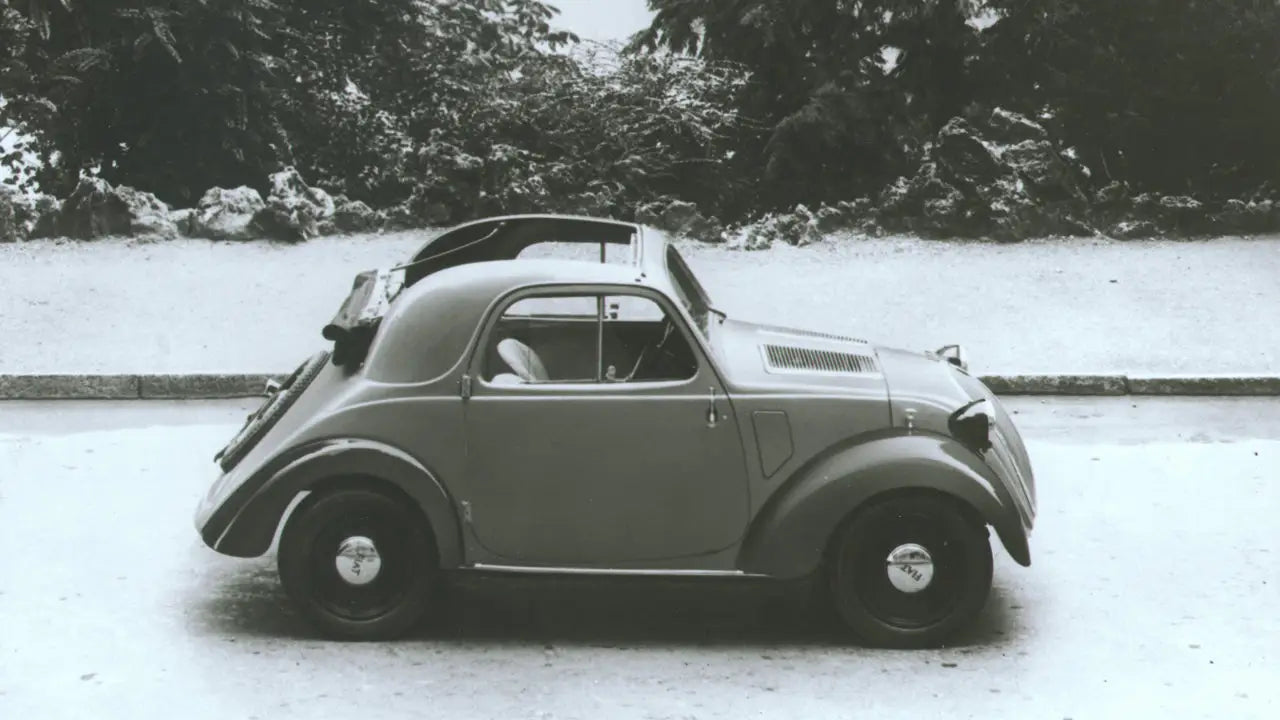 Frontal view of the modern Fiat Topolino showcasing its compact LED headlights