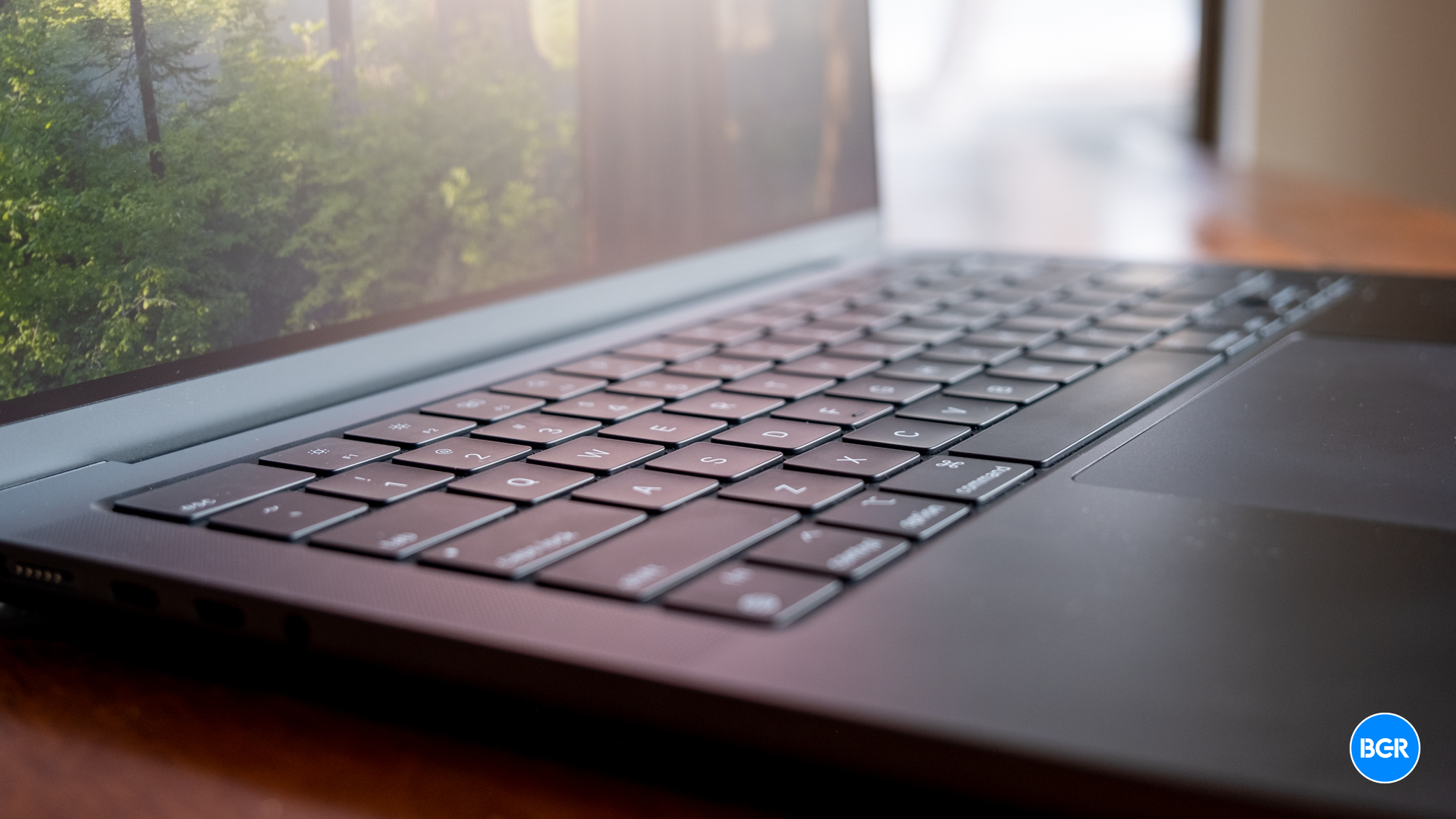Top-down view of the MacBook Pro M4 keyboard and trackpad in Space Black.