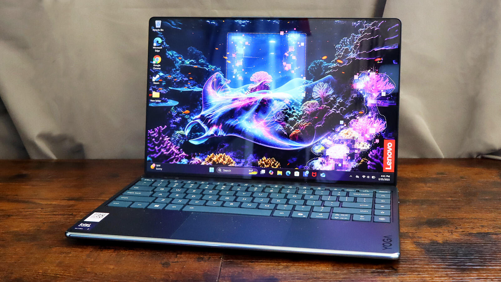 Slim Lenovo Yoga laptop with a vibrant high-resolution screen.