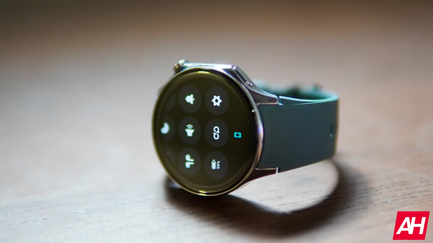 A close-up of the OnePlus Watch 2 on a wrist showing a detailed analog watch face.