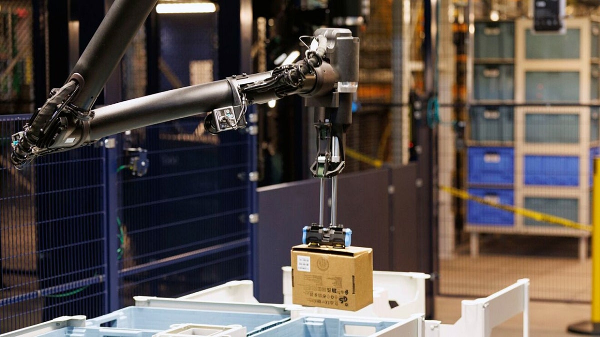 The Blue Jay robot maneuvering a package, highlighting its intricate mechanical limb design.