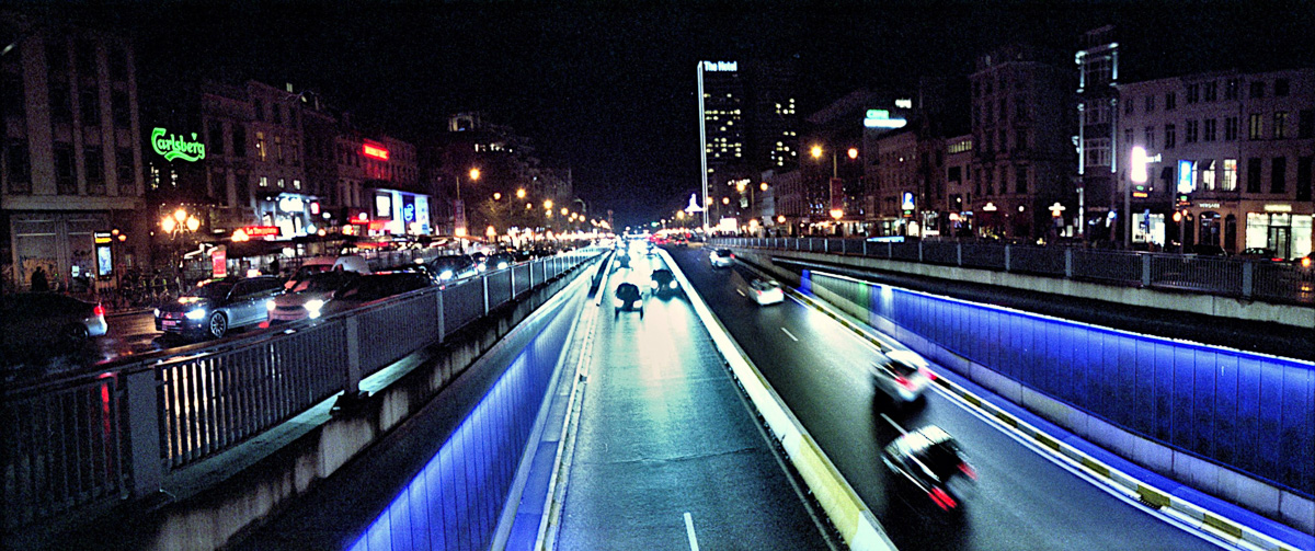 A wide panoramic night shot of Brussels showing sharp details and straight architectural lines.