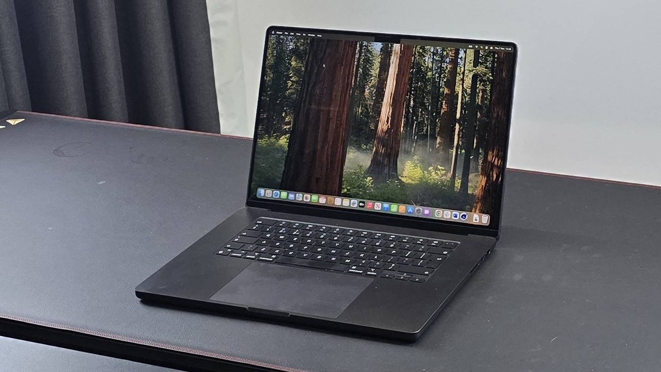 A 16-inch MacBook Pro M4 Pro in a professional studio setting.