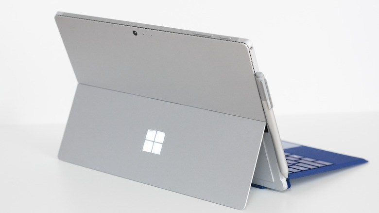 A Microsoft Surface Pro tablet with its signature kickstand and detachable keyboard.