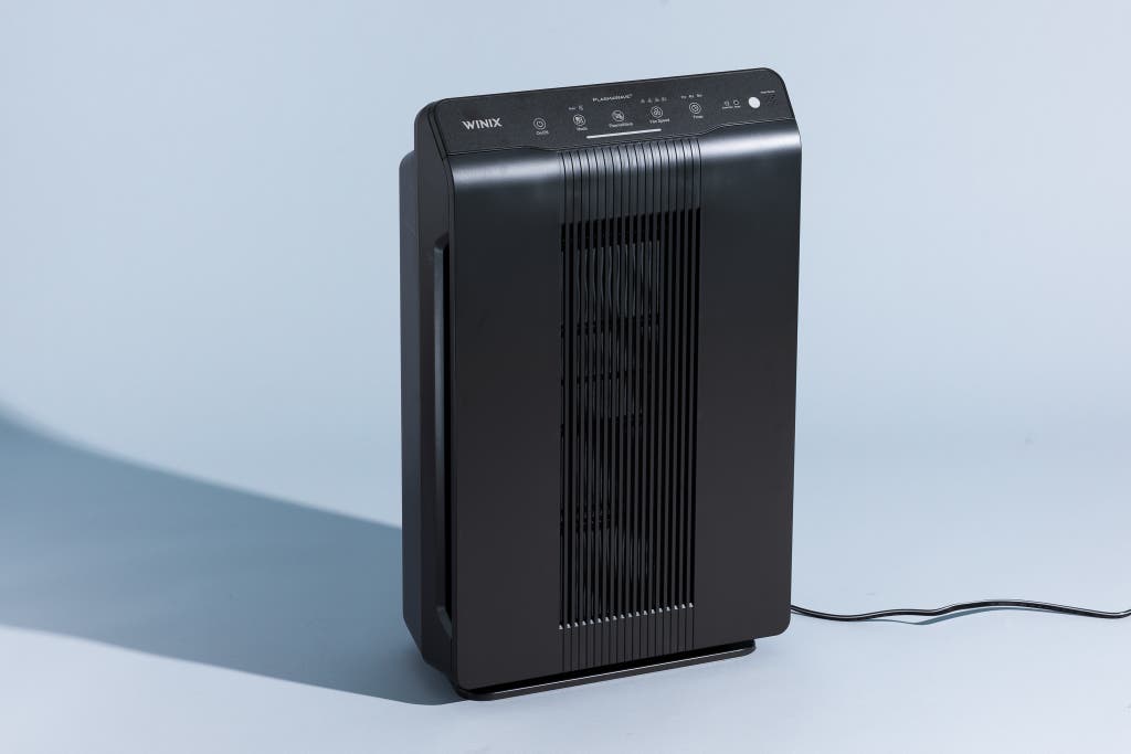 A black Winix 5500-2 air purifier showing its front intake panel.
