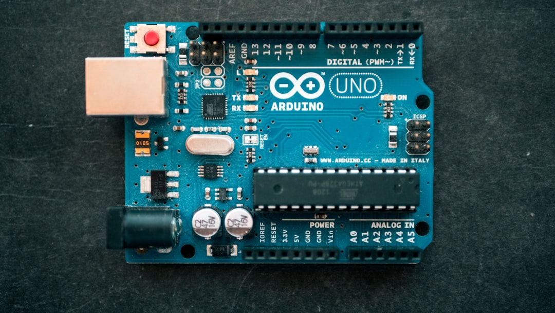 A standard blue Arduino Uno microcontroller board
