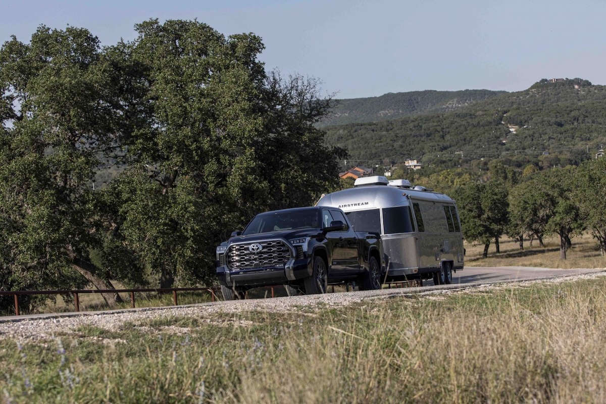 Front perspective of a 2026 Toyota Tundra hybrid pickup truck in a rugged outdoor setting.