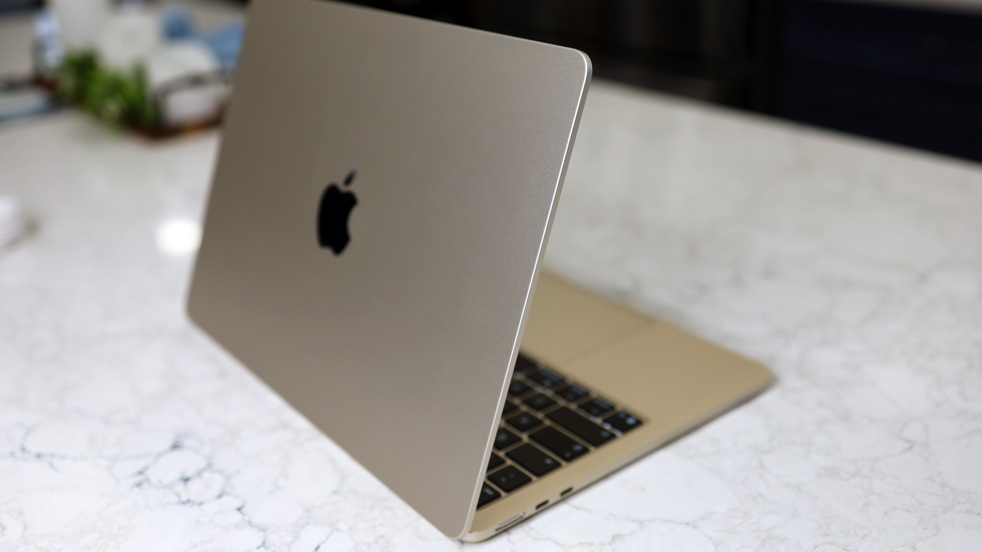 Detailed view of the Thunderbolt 4 and MagSafe 3 ports on the side of the M5 MacBook Air.