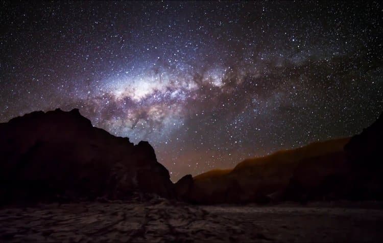 The Milky Way galaxy spanning across the night sky over the Chilean mountains.